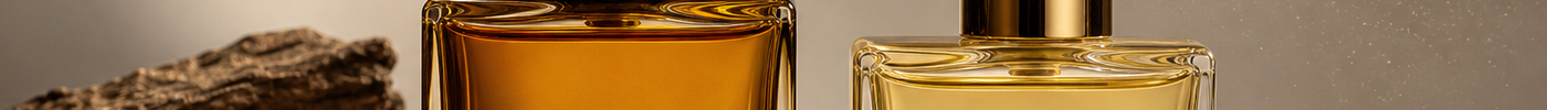 Two perfume bottles on a neutral surface representing extrait de parfum and eau de parfum.